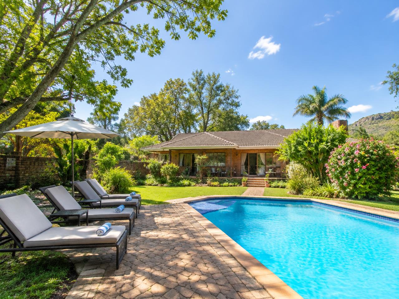 Pool deck and garden at Zea85 B&B